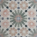 Patterned levante ceramic matt floor tile with geometric floral design in muted pink gray and black tones