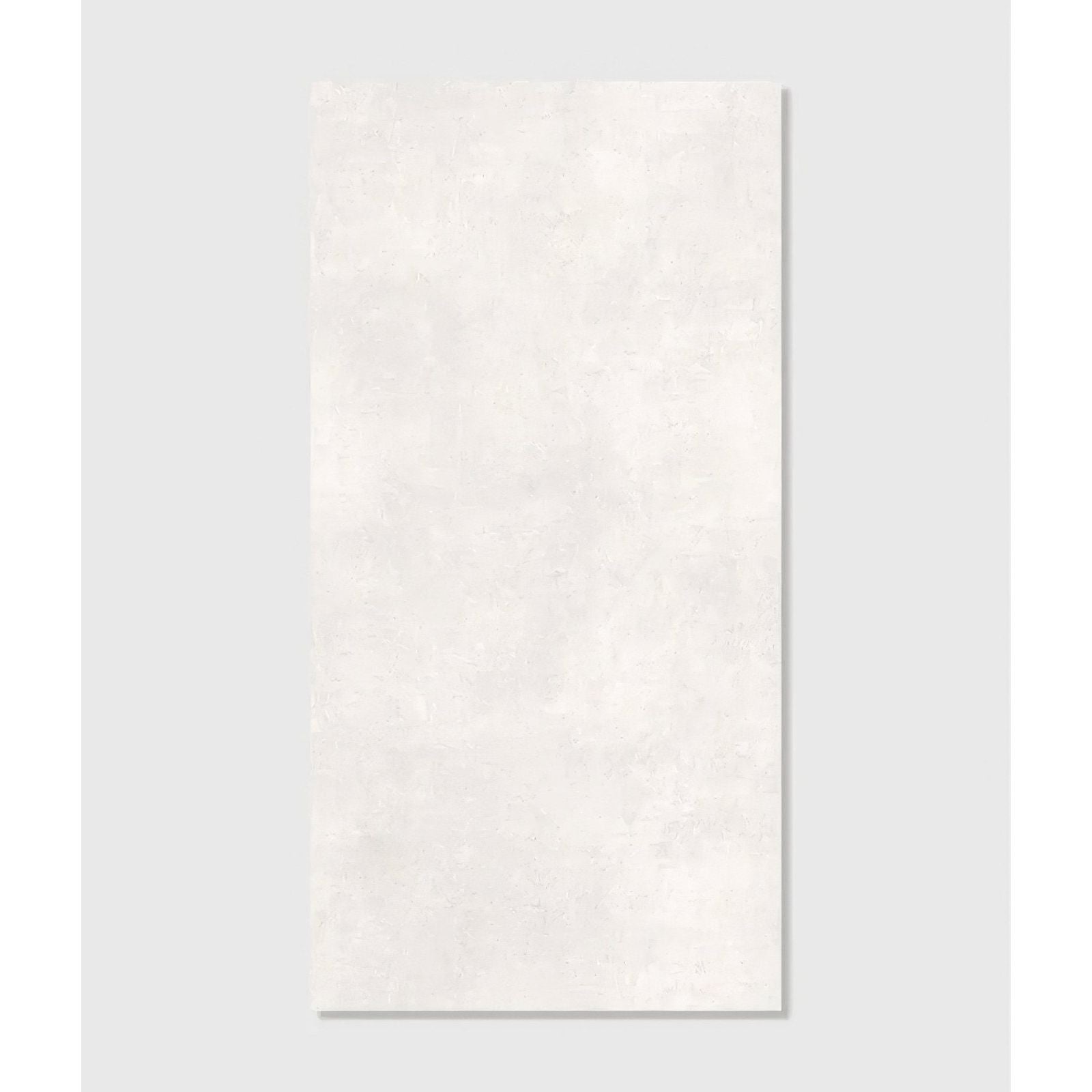 A rectangular off-white ceramic tile with subtle texture loft porcelain pearl 120 x 60cm