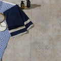 Navy blue towel with two white stripes at the hem from the loft vintage porcelain pearl collection