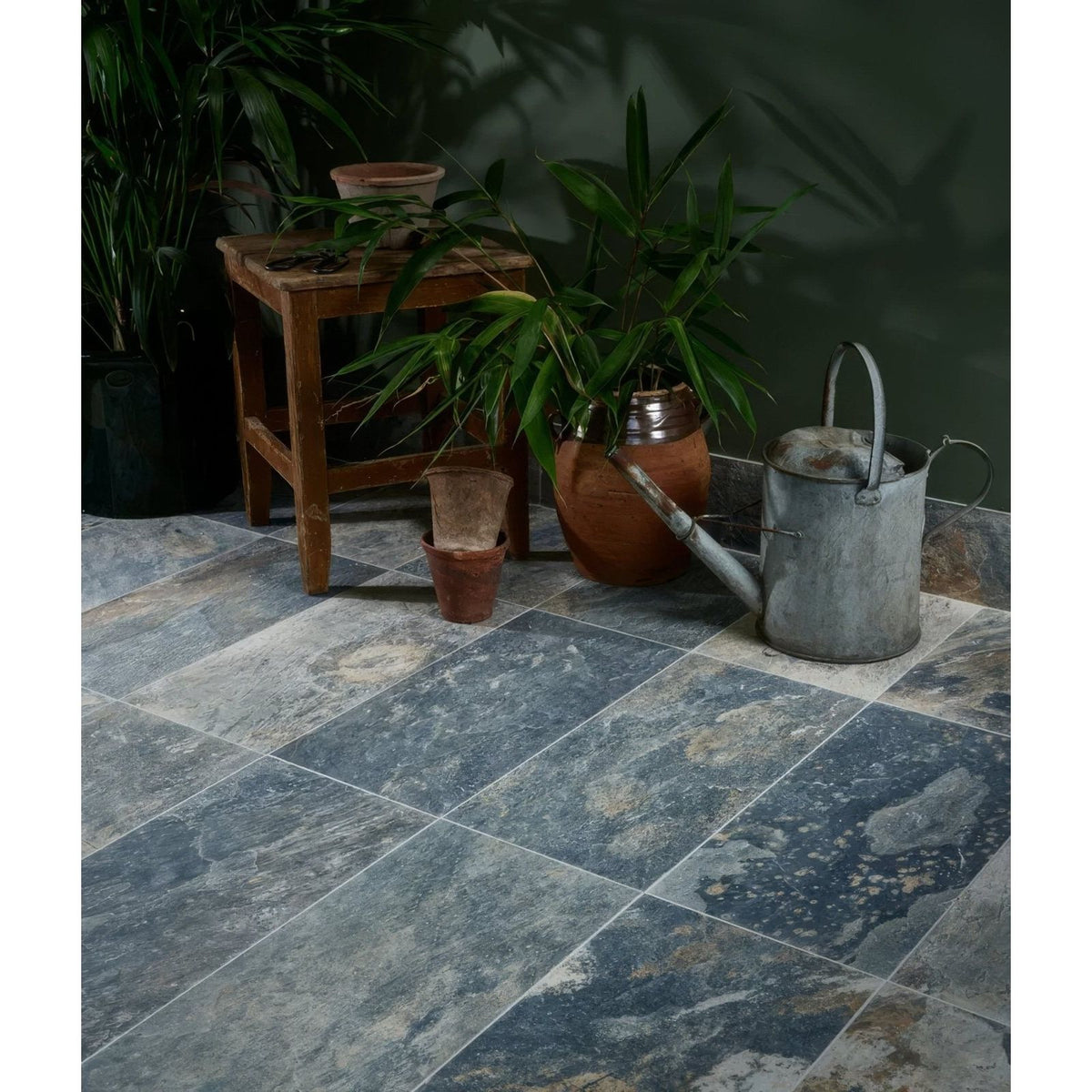 Dark blue and gray stone effect porcelain floor tiles with natural marbled texture from lombok porcelain moss collection