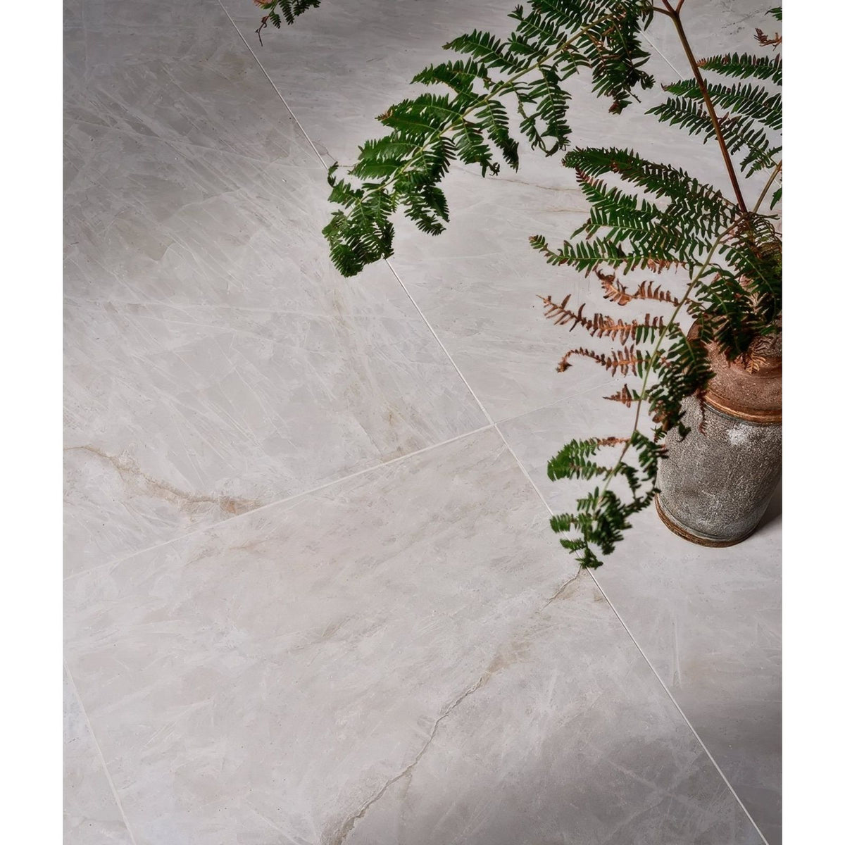 Light gray marble-effect manhattan porcelain matt floor tiles with subtle veining and a matt finish