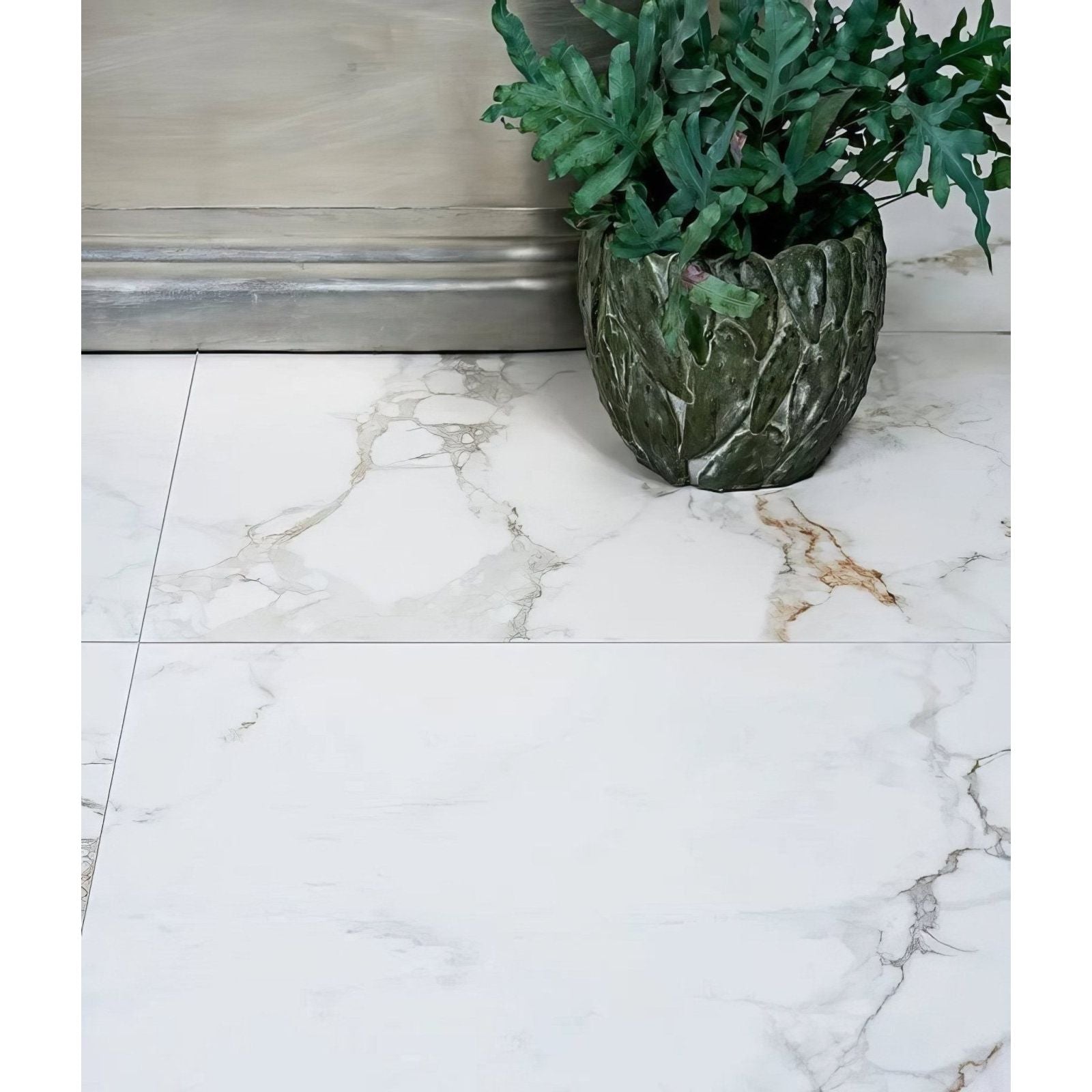 Muscat Porcelain 59.5 x 59.5cm white marble-effect tiles with a planter and fern