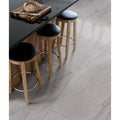 Mystery White Porcelain Matt 59.5 x 120cm white marble-effect tiles with wooden bar stools
