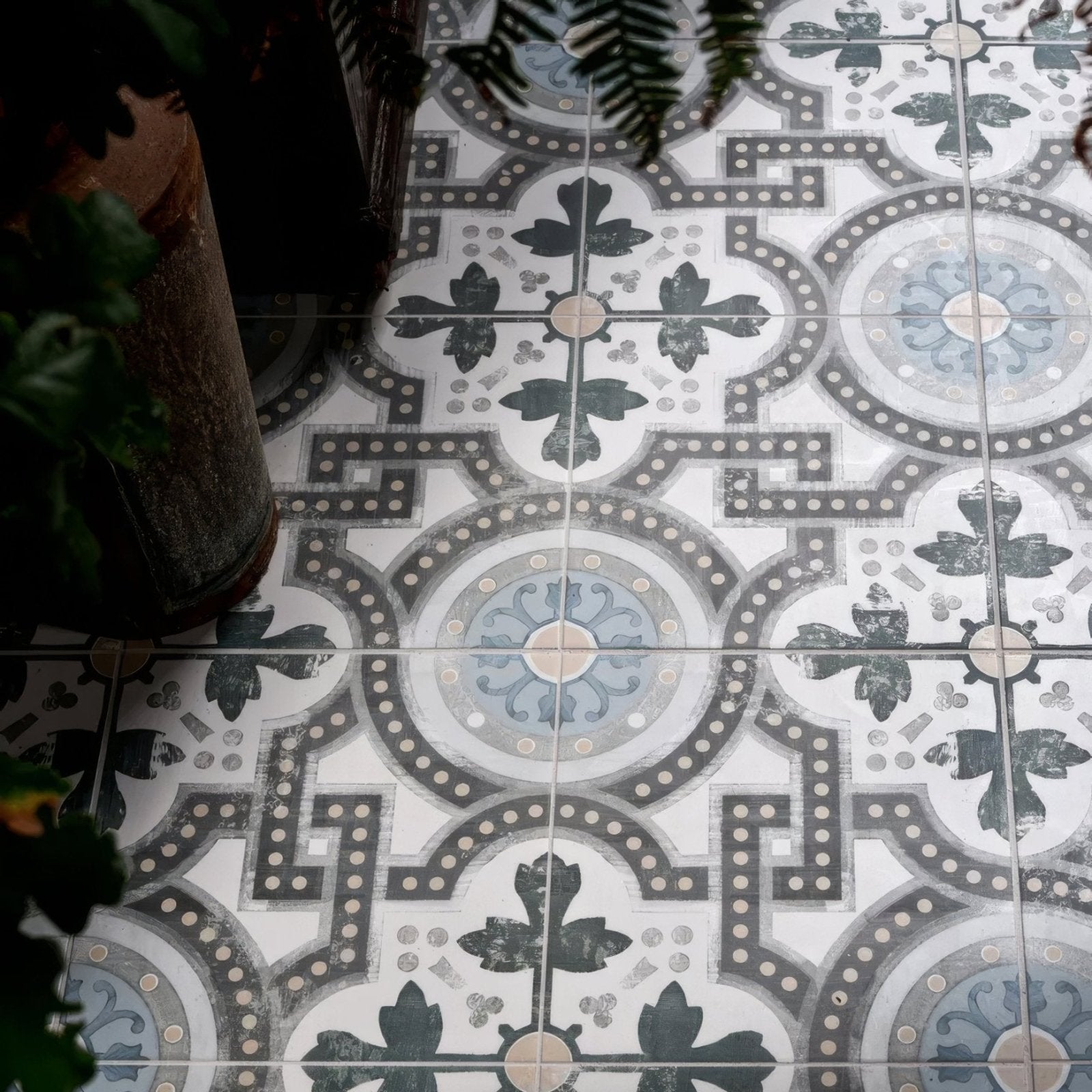 Orleans ceramic matt floor tiles with vintage black gray and light blue floral patterns on white background