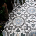 Orleans ceramic matt floor tiles with vintage black gray and light blue floral patterns on white background
