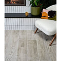 Parterre porcelain plank gray wood-grain vinyl flooring with subtle natural texture and light gray tones