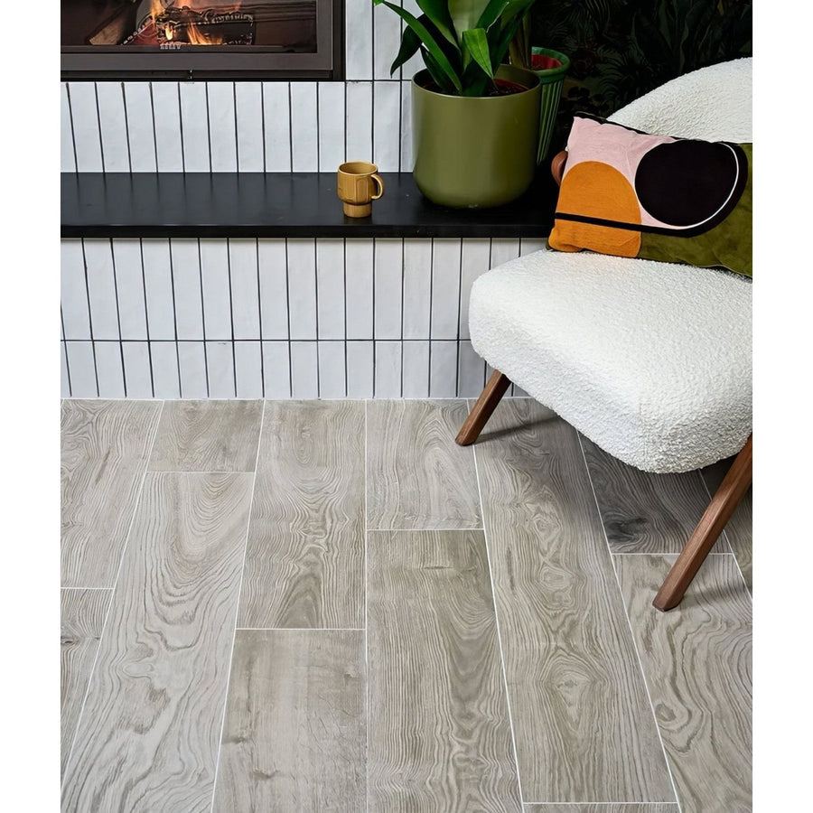 Parterre porcelain plank gray wood-grain vinyl flooring with subtle natural texture and light gray tones