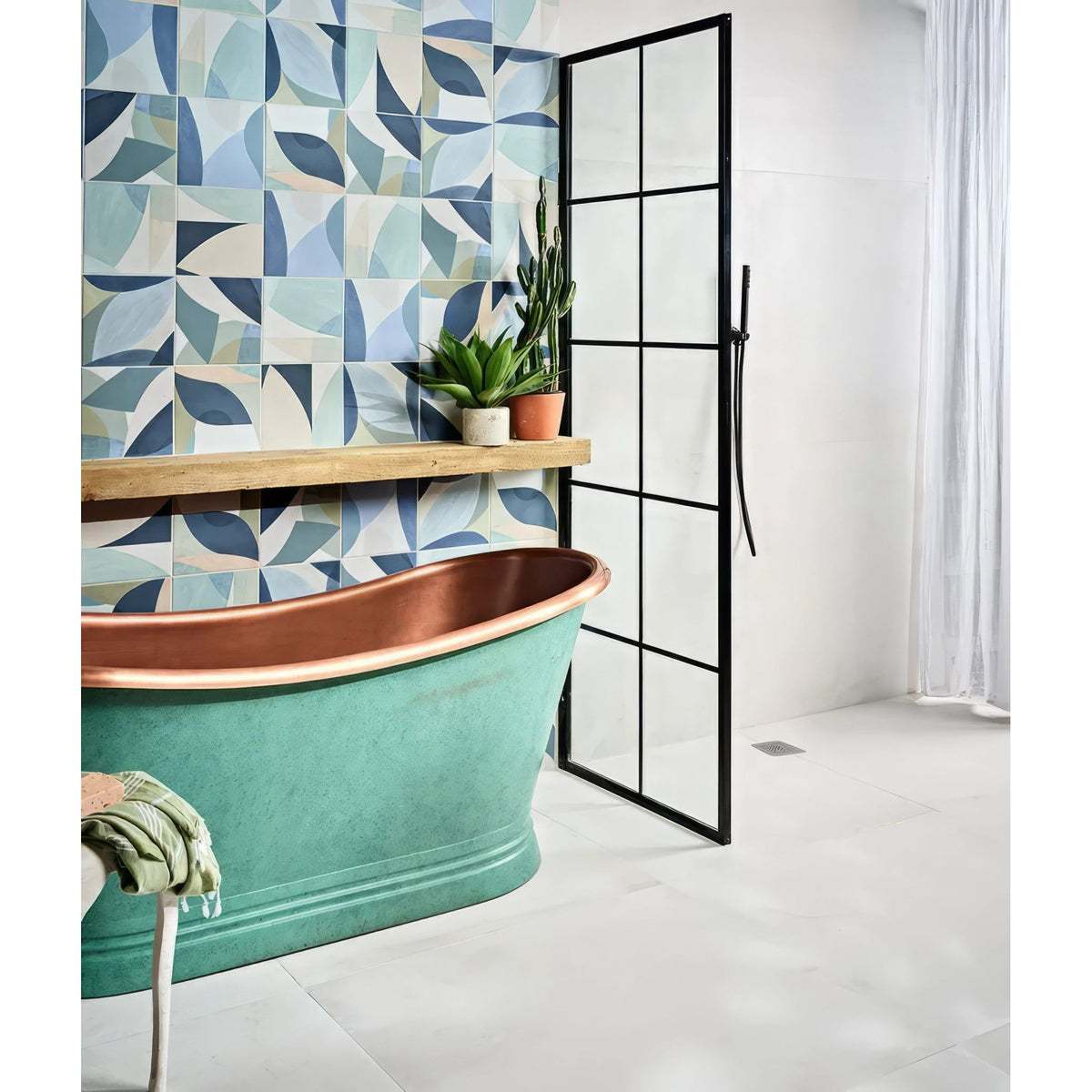 Teal copper bathtub with polished interior and vintage design from the rio porcelain collection