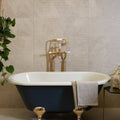Riverside Wall Ceramic Linear Perla white ceramic tiles with a blue clawfoot bathtub