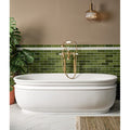 Soprano Porcelain 60 x 120cm cream marble-effect tiles with a freestanding bathtub and green subway tiles
