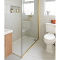 Soprano Porcelain cream marble-effect tiles with a glass shower enclosure