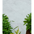 Light gray subtly textured southdown porcelain paving tiles with clean white grout lines for outdoor flooring