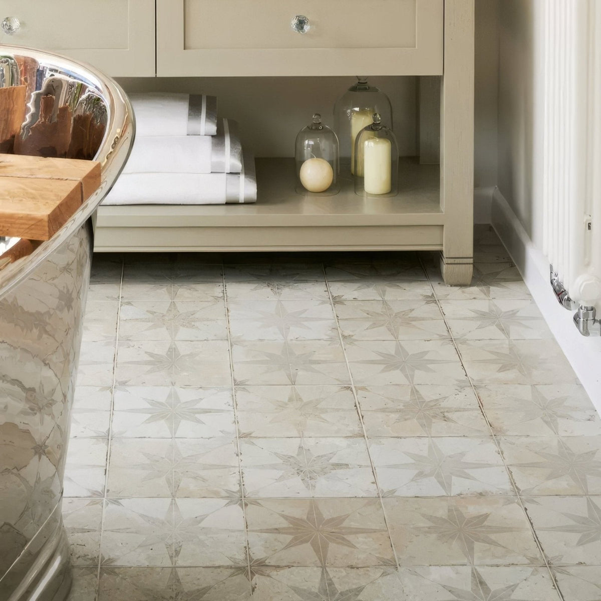 Beige star-patterned marble-effect ceramic floor tiles from spitalfields ceramic retro star white collection