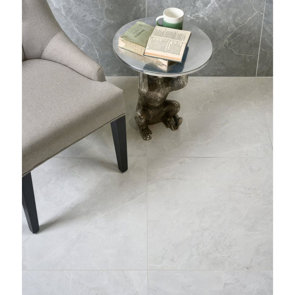 Tribeca Porcelain Blanco 60 x 120cm white marble-effect tiles with a bronze monkey side table