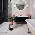 Tribeca Porcelain Blanco 60 x 60cm white marble-effect tiles with a black floating vanity and two bowl sinks