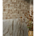 The wall features pottery porcelain oatmeal square large marble-look tiles below beige taupe ceramic mosaic tiles