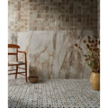 Beige and gray mosaic tile wall with a marble-like pattern from pottery porcelain oatmeal square collection
