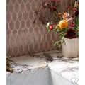 Preen Porcelain Mosaic Blush rose gold scalloped porcelain mosaic with a white vase of flowers