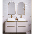 Preen Porcelain Mosaic White white porcelain fish-scale mosaic with a white vanity and gold hardware