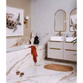 Preen Porcelain Mosaic White white porcelain fish-scale mosaic with a marble bathtub and gold fixtures