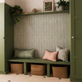 Promenade Hastings 60x30cm green wooden bench with three woven wicker baskets and decorative pillows on seat