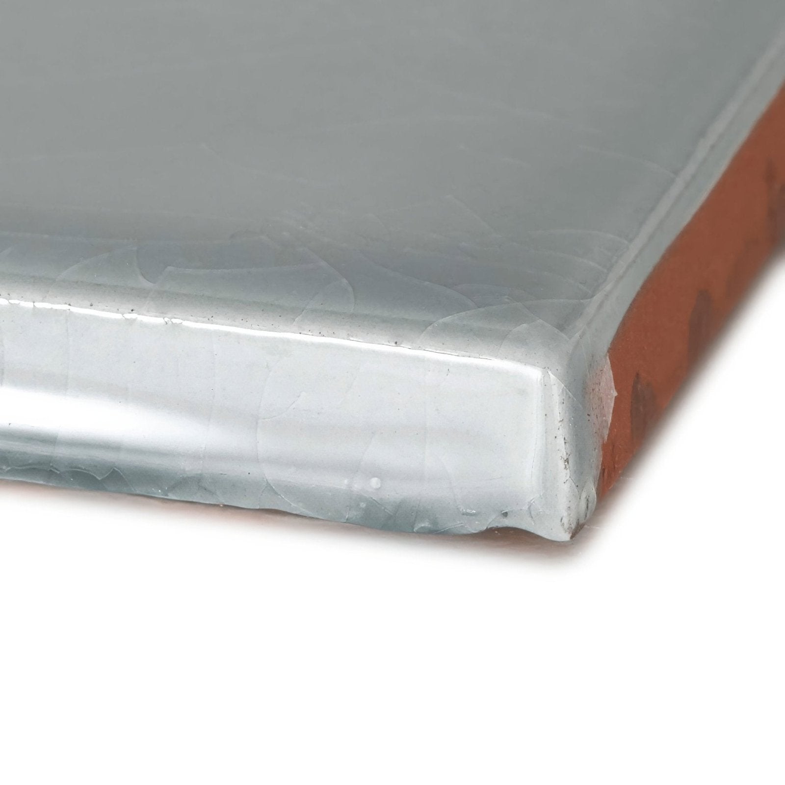 Clear plastic-wrapped rectangular Provence Falicon square board with visible orange interior edge and smooth surface
