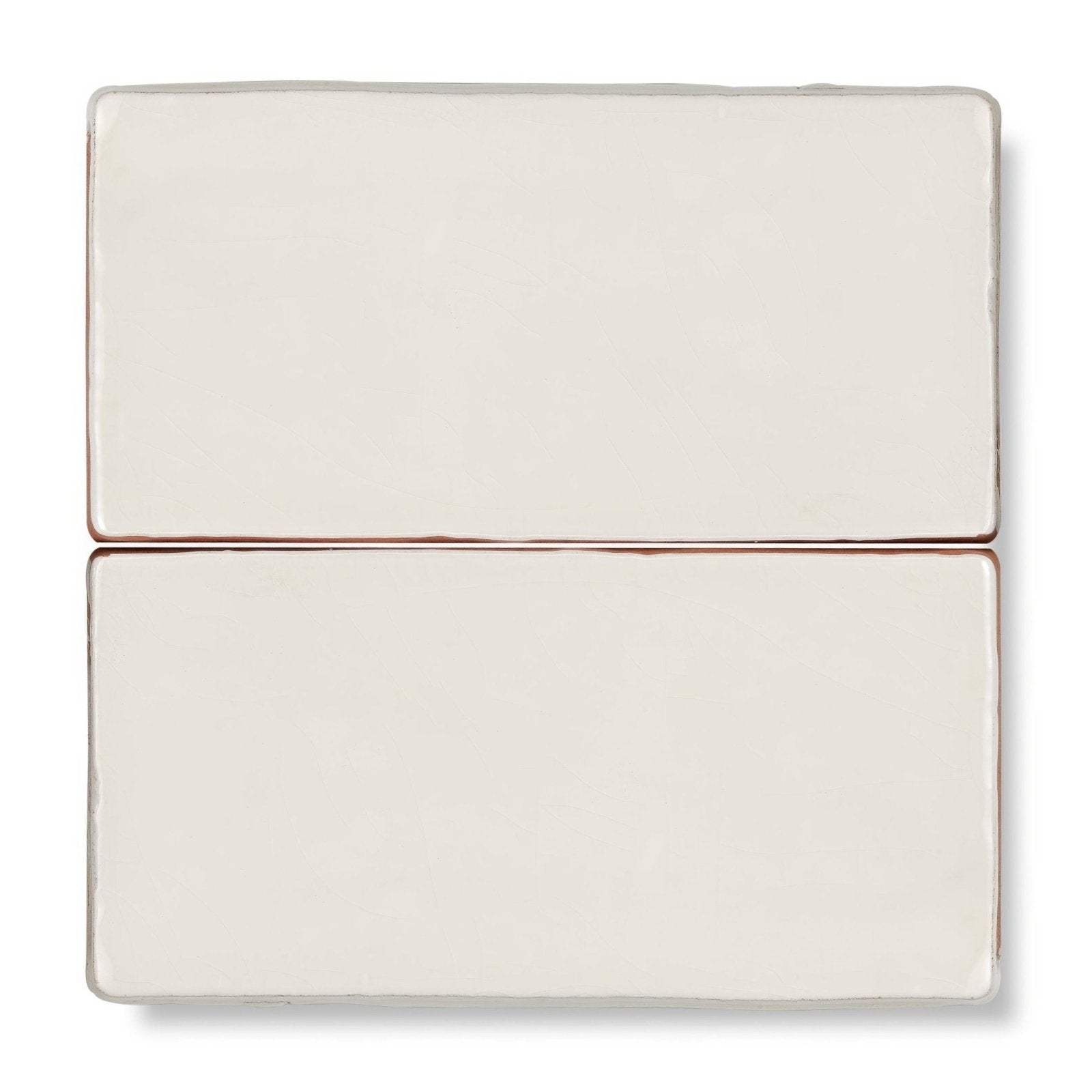 Two cream-colored ceramic provence menton rectangle tiles with subtle matte finish and slightly rounded edges