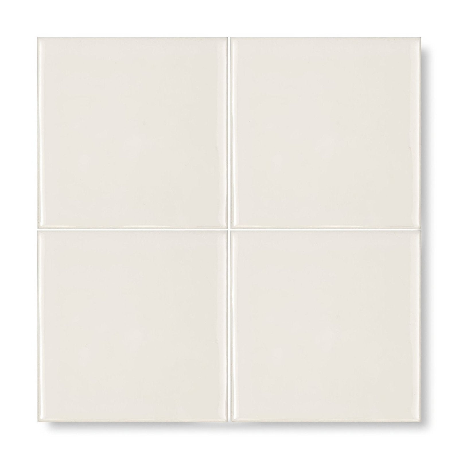 Four square glossy off-white ceramic tiles arranged in a grid from provence menton square glazed tile collection