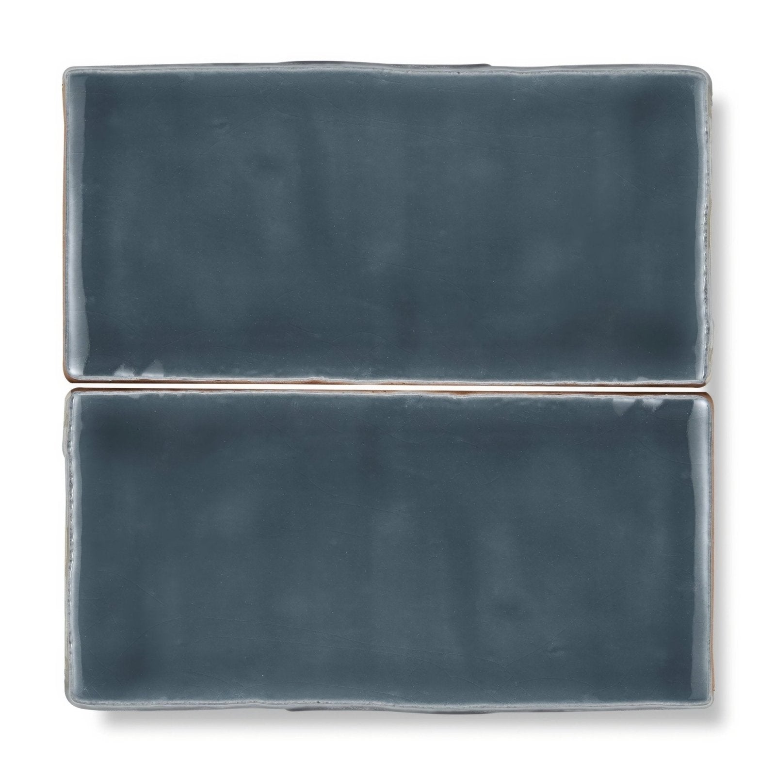 Two rectangular ceramic tiles with matte slate blue glaze and uneven edges from provence peillon rectangle collection
