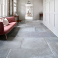 Gray stone porcelain floor tiles with a matte slightly textured finish from provence porcelain cenere collection
