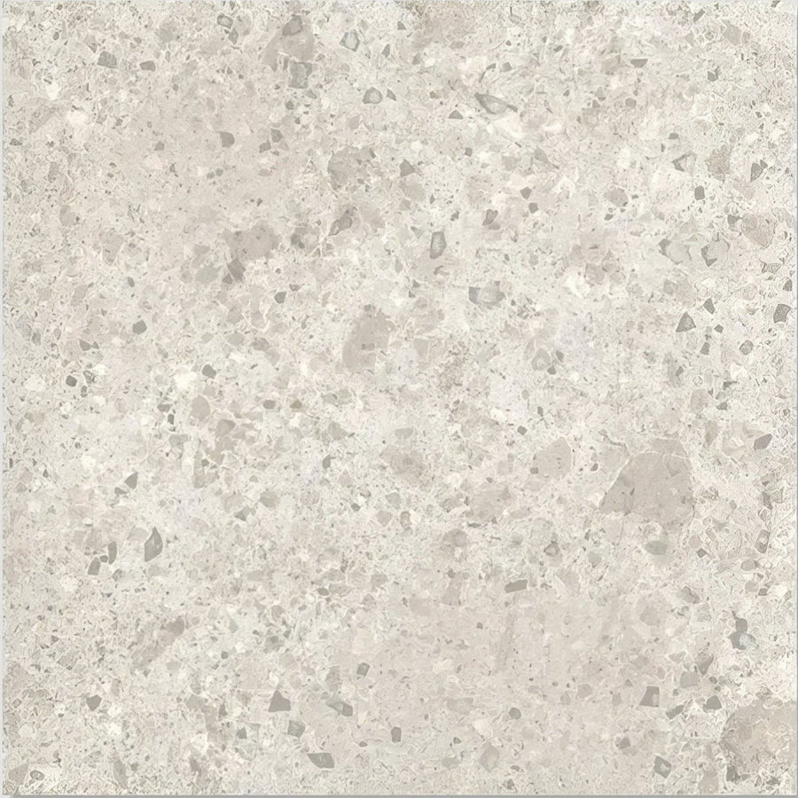 Pumice porcelain off white light gray terrazzo tile with speckled darker gray and white flecks pattern