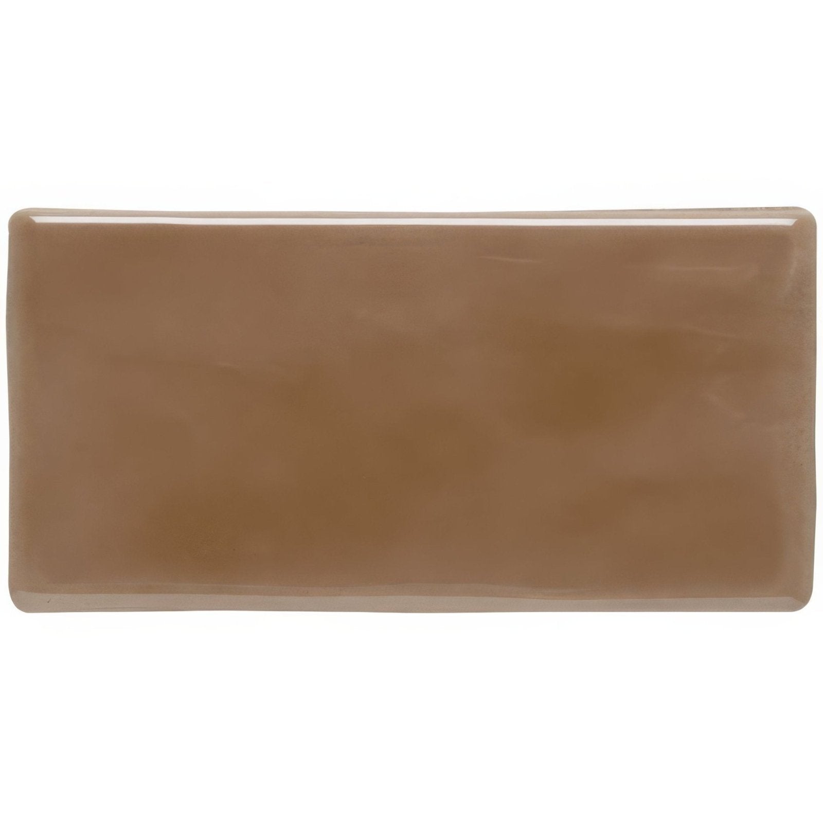 A smooth glossy tan putty half tile with rounded edges ideal for wall and backsplash applications
