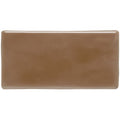 A smooth glossy tan putty half tile with rounded edges ideal for wall and backsplash applications