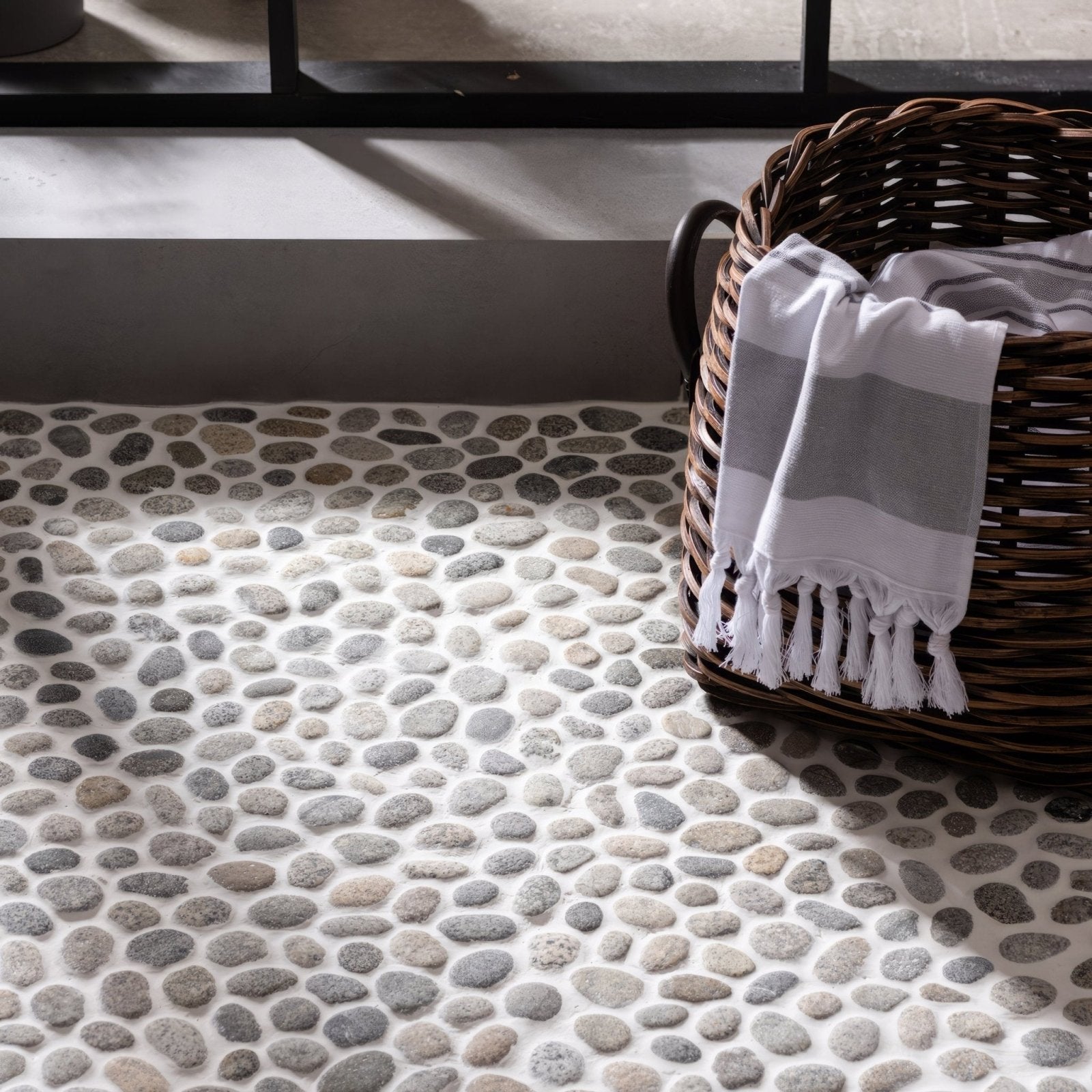 Quail Maui pebble mosaics floor featuring smooth rounded river stones in gray and beige set in light grout