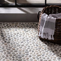 Quail Maui pebble mosaics floor featuring smooth rounded river stones in gray and beige set in light grout