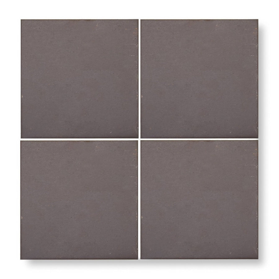 Quarry black square tile with four matte-finished dark gray ceramic tiles arranged in a grid