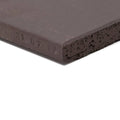 Dark gray quarry black square tile with textured porous surface and slightly chipped edges for flooring and walls