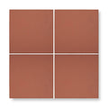Four square quarry red terracotta tiles with a matte finish and uniform reddish brown color arranged in a grid