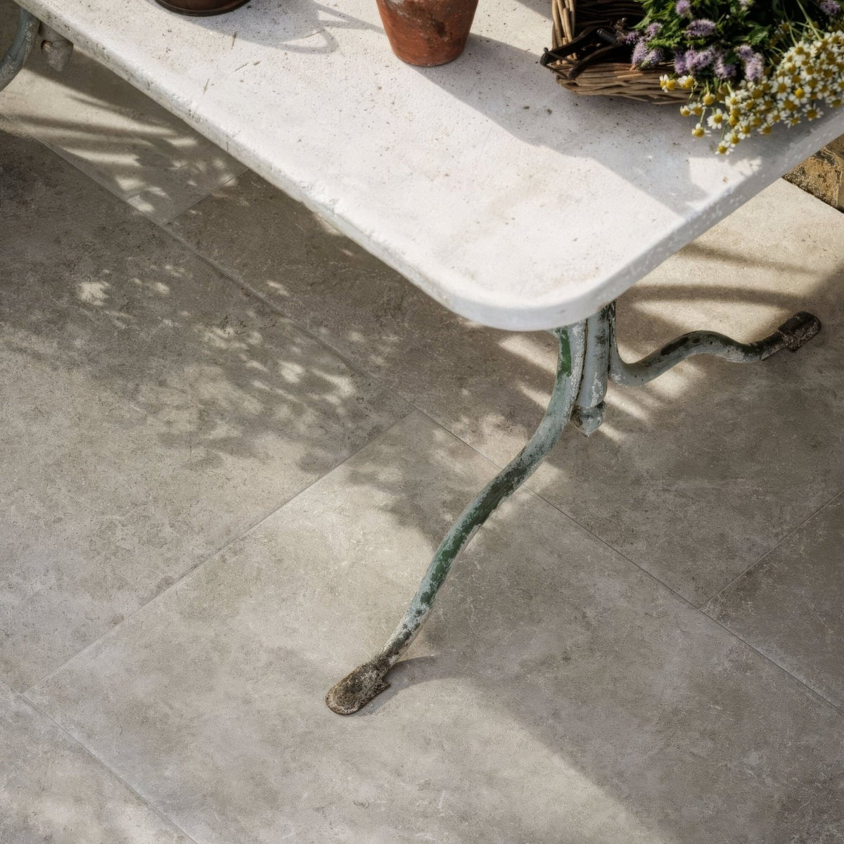Antique-style wrought iron table leg with verdigris patina and ornate curved design for quintili sand 60 x 90cm table