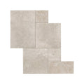Beige stone tiles quintili sand opus with natural slightly textured surface arranged in an irregular pattern