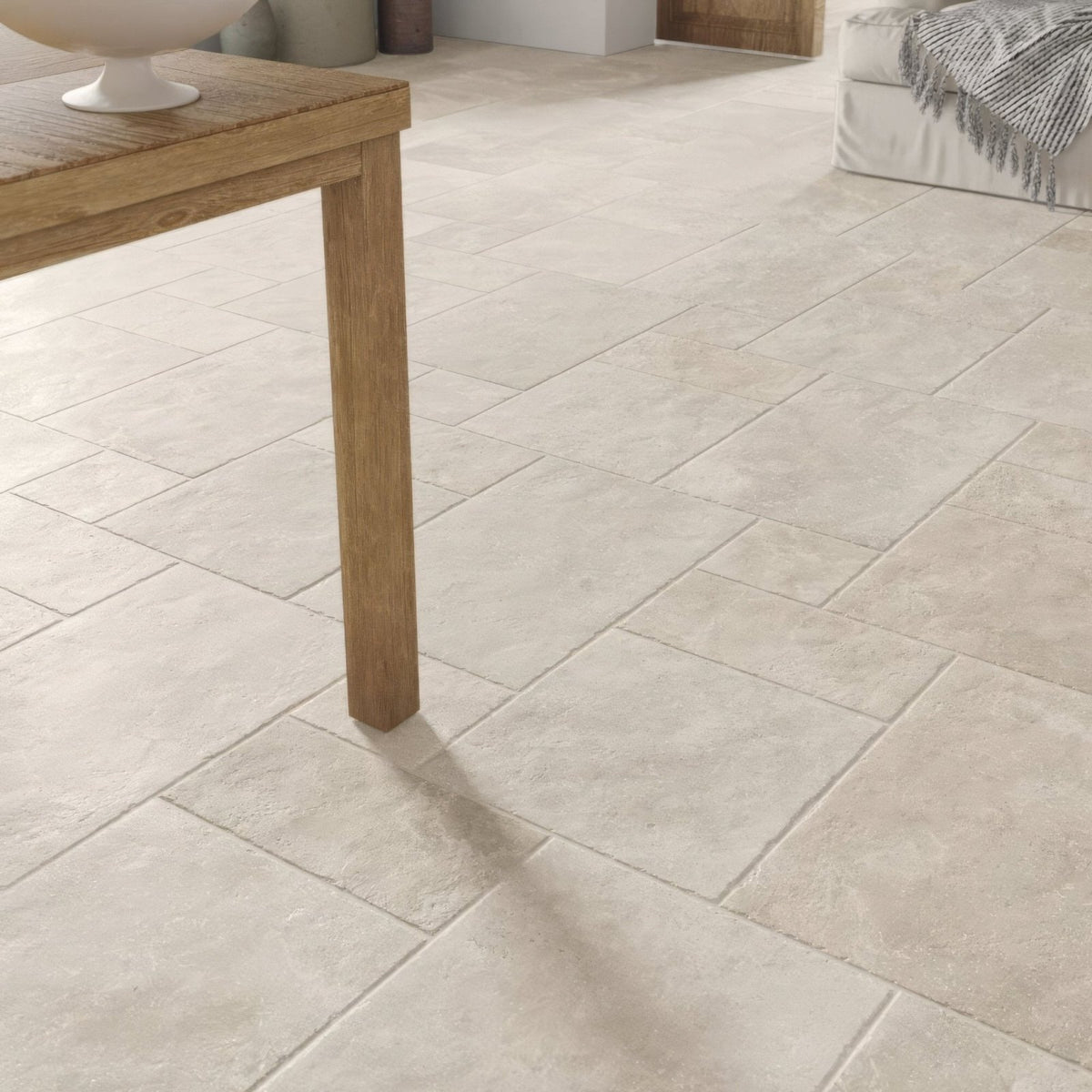 Beige stone-effect quintili sand opus floor tiles with a subtle textured finish for indoor flooring use