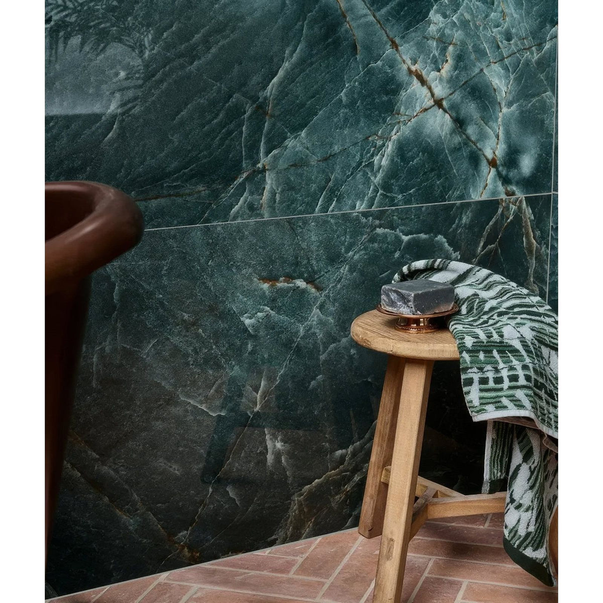 A dark green marble-patterned rainforest porcelain jade bathroom wall with subtle veining and a glossy finish