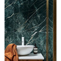 Rainforest Porcelain Malachite dark green marble-effect tiles with a white bowl sink