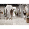 Rapolano 1868 Grey Polished grey stone-effect tiles in a minimalist retail interior