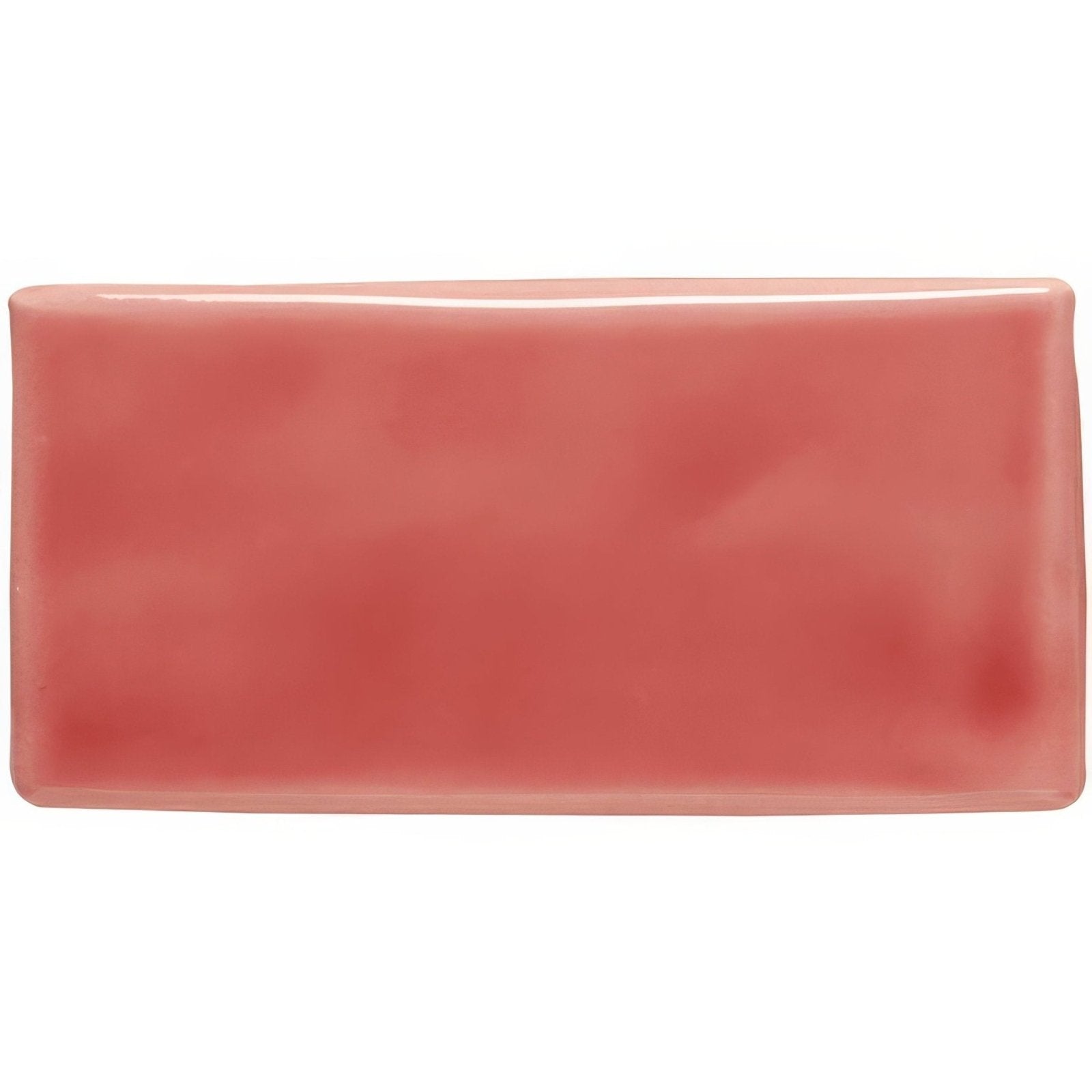A glossy coral-colored rectangular ceramic tile with rounded edges called raspberry half tile