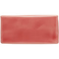 A glossy coral-colored rectangular ceramic tile with rounded edges called raspberry half tile