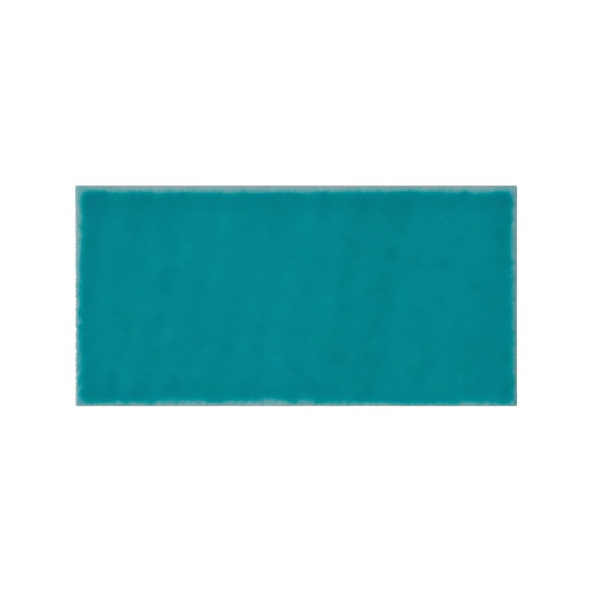 
A solid teal rectangular Ravello Frezza tile with a smooth glossy finish ideal for wall and floor surfaces