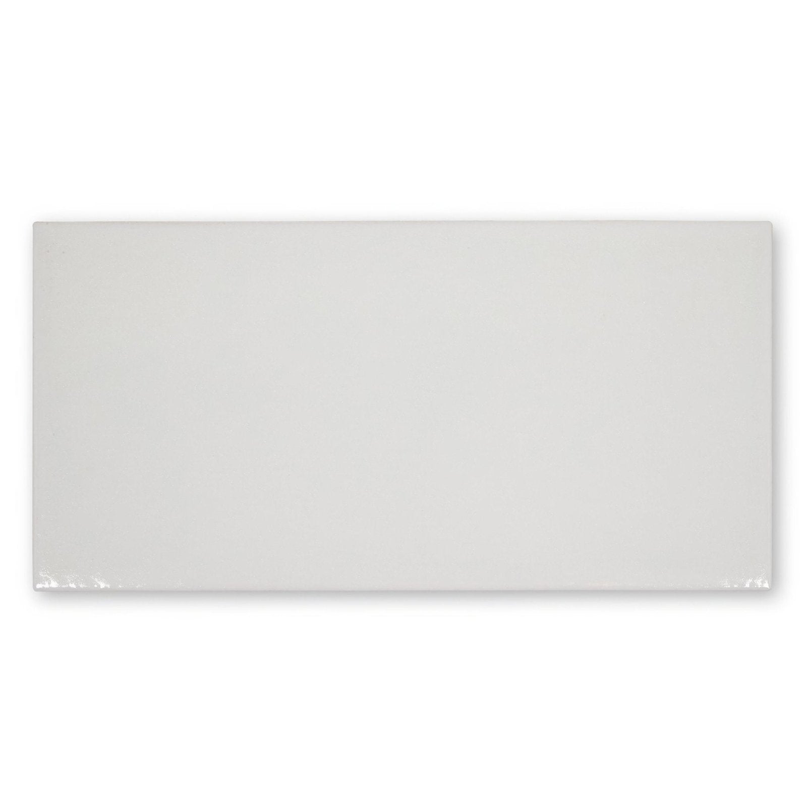 A sleek rectangular white ceramic tile with a smooth glossy finish from ravello grazie collection