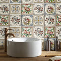 White ceramic vessel sink with matte bronze faucet featuring red poppies floral border on county white background