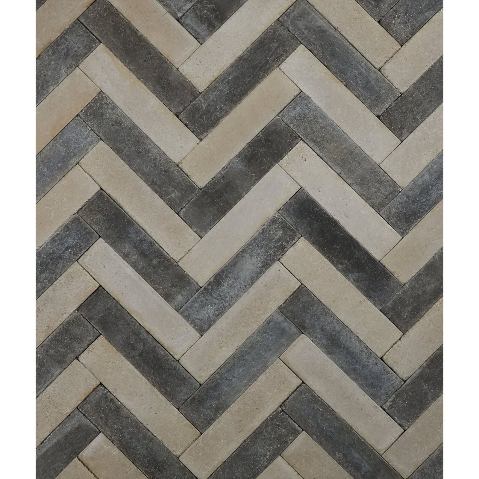 Reform composite stone tumbled bianco features herringbone-patterned stone tiles in beige and dark gray tones